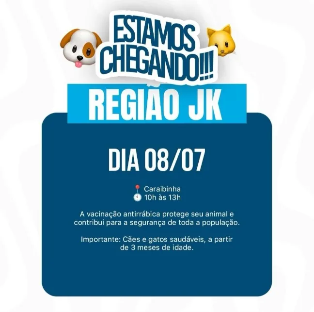 Este é um cartaz publicitário da Prefeitura de Formosa focado na Região JK para o dia 08/07. Na parte superior, o texto "ESTAMOS CHEGANDO!!!" em azul e branco, acompanhado por ícones de emojis de um cachorro e um gato. Abaixo, em um retângulo azul claro, lê-se "REGIÃO JK" e, em um retângulo verde claro, "DIA 08/07".
O corpo do cartaz é um retângulo azul escuro com o texto: um ícone de localização vermelho seguido de "Caraibinha" e um ícone de relógio cinza seguido de "10h às 13h". Abaixo, o texto informativo diz: "A vacinação antirrábica protege seu animal e contribui para a segurança de toda a população." E uma nota final: "Importante: Cães e gatos saudáveis, a partir de 3 meses de idade." O fundo é branco com detalhes sutis em azul.
